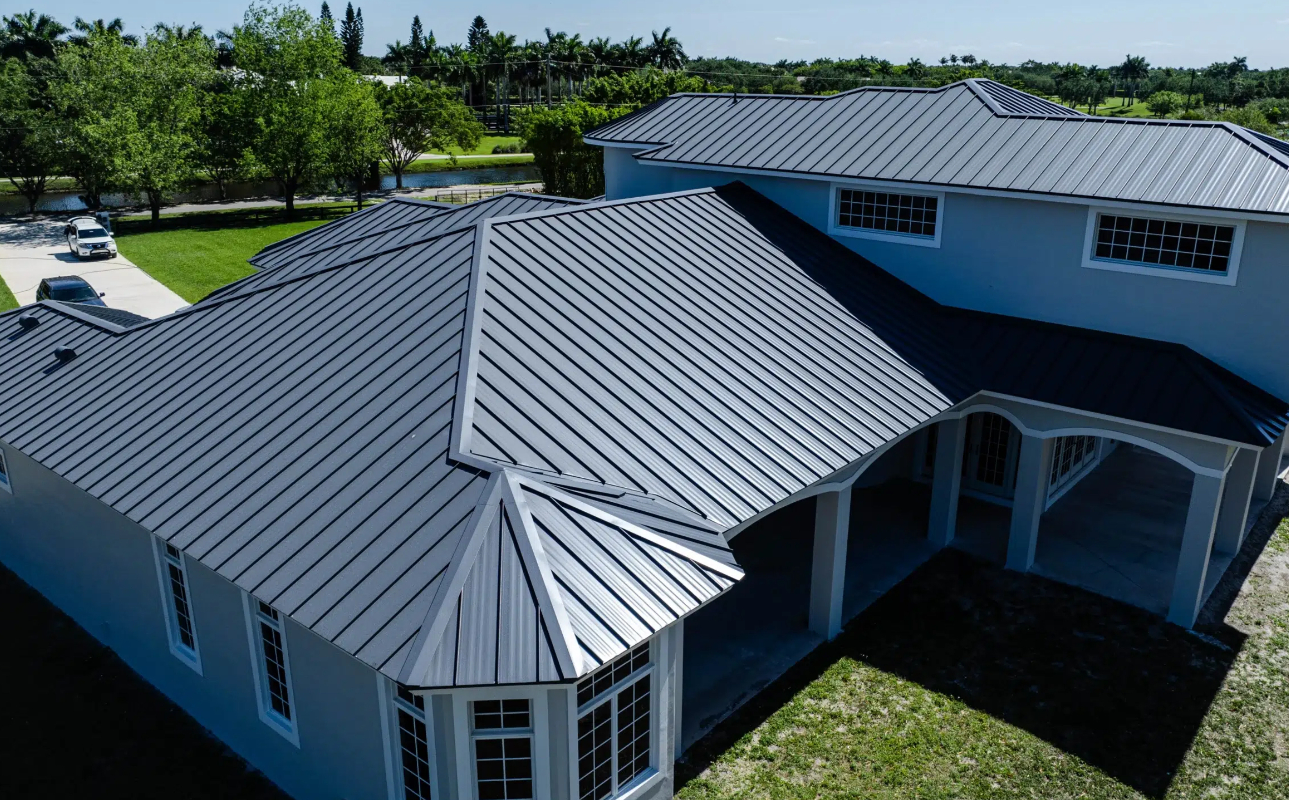 Metal roof panel overlap and fastener detail on a completed installation